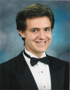 Matthew valencia in HS serior photo in tux