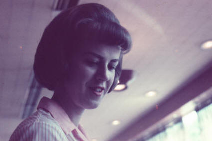 My Mom in 1965 with a crqazy hairdo while working at the flushing new york horn & hardardt