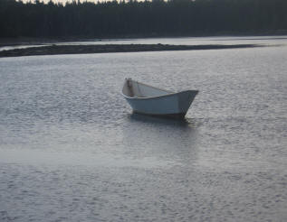 one empty rowboat on lake in cushing maine