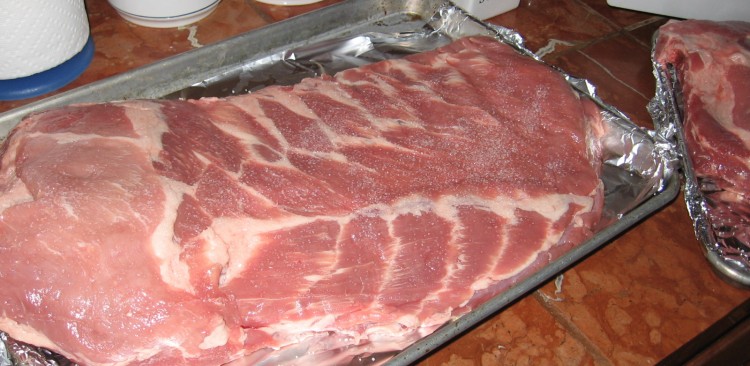 Rack of spare ribs set up on sheet pan