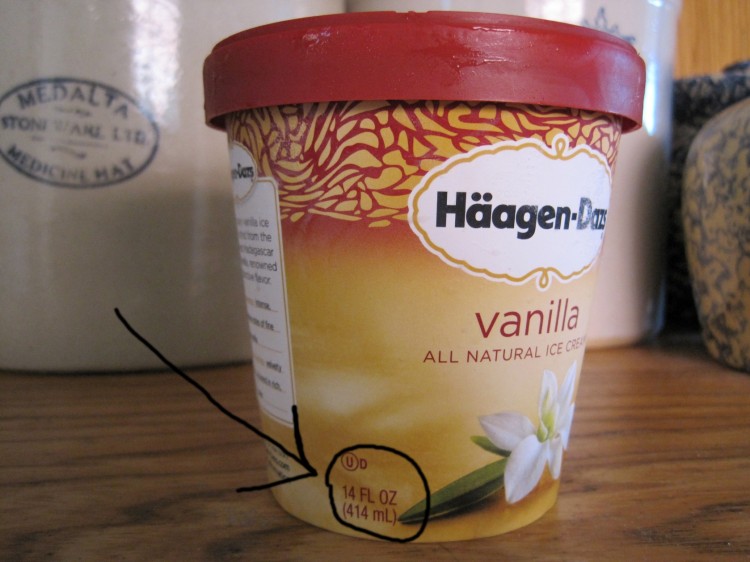 A 14-ounce container of Haagen-Dazs ice cream with the weight circled in marker.