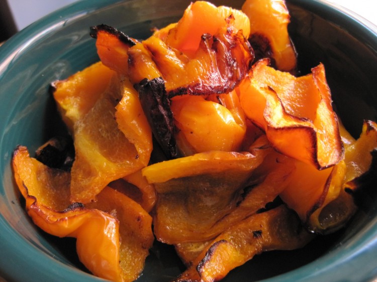 roasted yellow peppers in a green bowl
