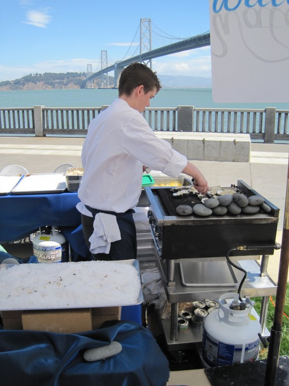 Waterbar stall at oysterfest 2010 in SF and grill full of hot stones and oysters