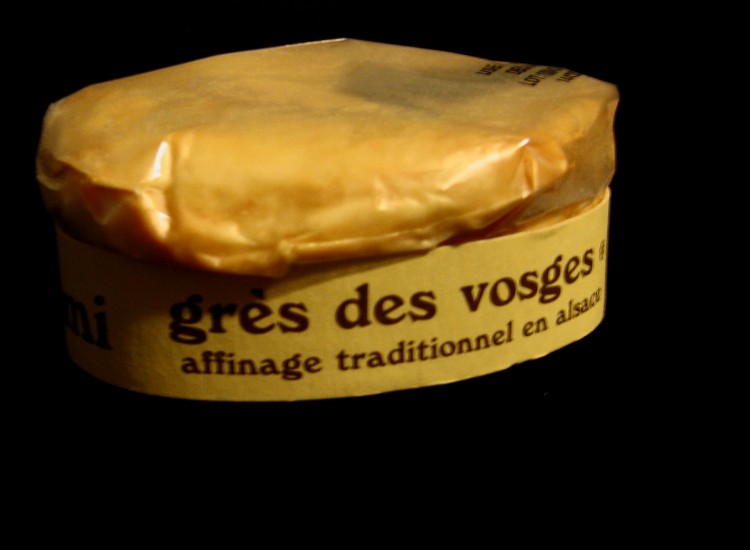 125 gram box of gres des vosges cheese on black background