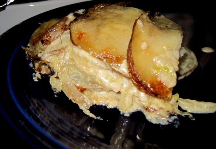 Serving of potato cabbage gratin on blue fiestaware