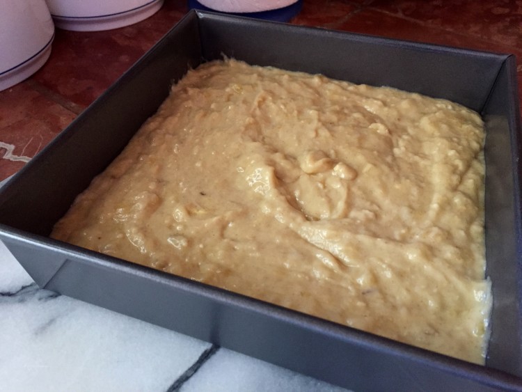 Banana bread batter in cake pan